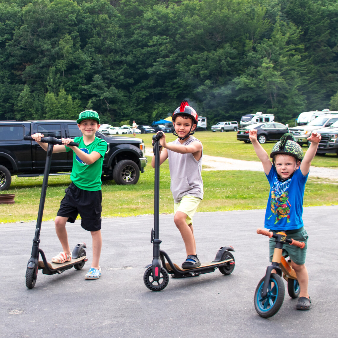 Boys on scooters at Gunstock Campground